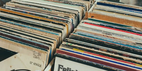 old vinyl records stored vertically in a box