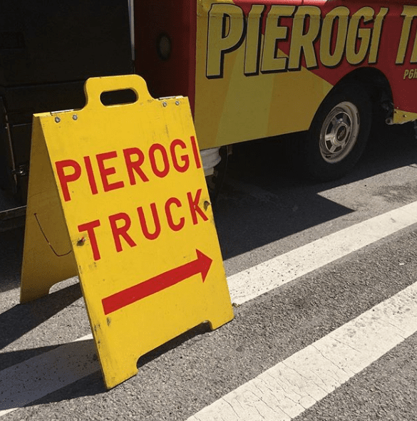 Pierogi Truck sign pointing to the Pierogi food truck that travels around Pittsburgh, PA.